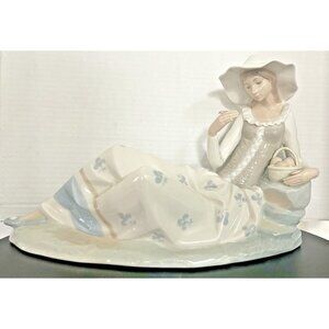 Vintage Lladro Nao Feminine Woman Girl Leaning On Rocks Wearing Hat & Corset